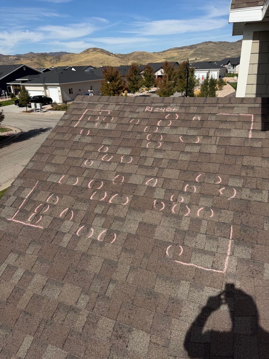 Hail-damaged roof with each hit located and marked